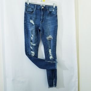 Distressed mid rise skinny jeans